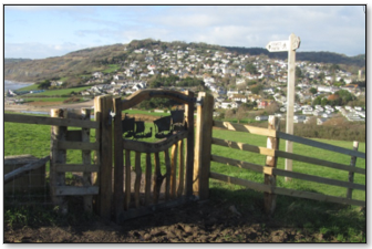 Coast Path- New Parish Gate on Stonebarrow, looking west to the village